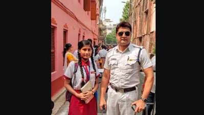 The image shows the Kolkata cop with the student he helped. (Facebook/@Kolkata Police)