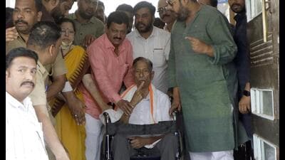 Girish Bapat came on a wheelchair to cast his vote at Ahilyadevi School near Motibaug on Sunday. (Rahul Raut/HT PHOTO)