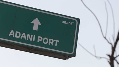 Road signage of Adani Port of Adani Group in Mundra, Gujarat, India, on Wednesday, Feb. 8, 2023.  (Bloomberg)