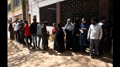 Residents line up to cast their ballots in Kasaba Peth constituency bypoll at Bhavani Peth on Sunday. (HT PHOTO) Residents line up to cast their ballots in Kasaba Peth constituency bypoll at Bhavani Peth on Sunday. (HT PHOTO)