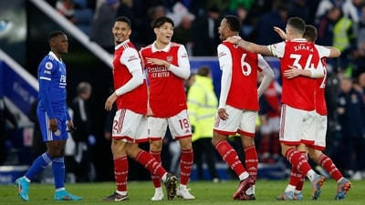 Arsenal's William Saliba, Takehiro Tomiyasu, and Gabriel celebrate after the match (Action Images via Reuters)