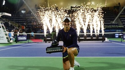 Czech Republic's Barbora Krejcikova celebrates with the trophy after winning the final against Poland's Iga Swiatek (REUTERS)