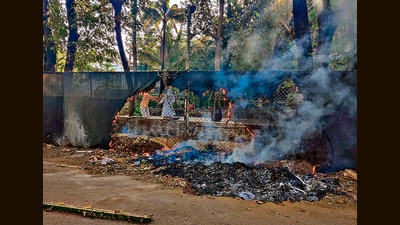 The recent incident of civic staff accidentally burning garbage in the open at a municipal garden underlines the need for strict measures to prevent such cases. (RAHUL RAUT/ HT) The recent incident of civic staff accidentally burning garbage in the open at a municipal garden underlines the need for strict measures to prevent such cases. (RAHUL RAUT/ HT)