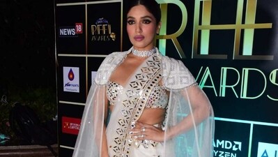 Bhumi Pednekar in white saree with a cape. Bhumi Pednekar in white saree with a cape. 