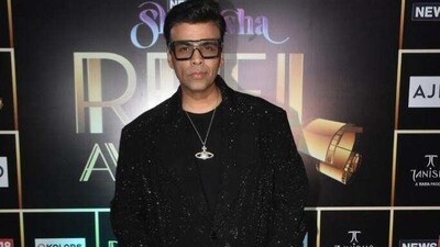 Karan Johar attended the event in a shimmery black suit. Karan Johar attended the event in a shimmery black suit.