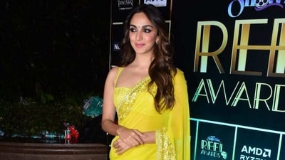 Newlywed Kiara Advani arrived in a yellow saree to the event. Newlywed Kiara Advani arrived in a yellow saree to the event. 