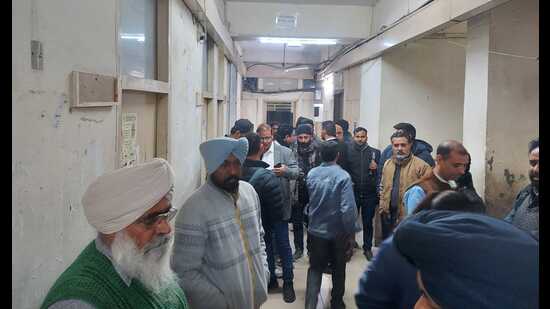 Locals outside RTO waiting for driving licences and RC in Ludhiana on Saturday. (HT photo)