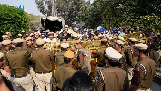 Delhi Police barricades to stop the AAP supporters during Delhi Deputy Chief Minister Manish Sisodia's visit to Rajghat ahead of his questioning by CBI in the liquor policy case, in New Delhi. Delhi Police barricades to stop the AAP supporters during Delhi Deputy Chief Minister Manish Sisodia's visit to Rajghat ahead of his questioning by CBI in the liquor policy case, in New Delhi.