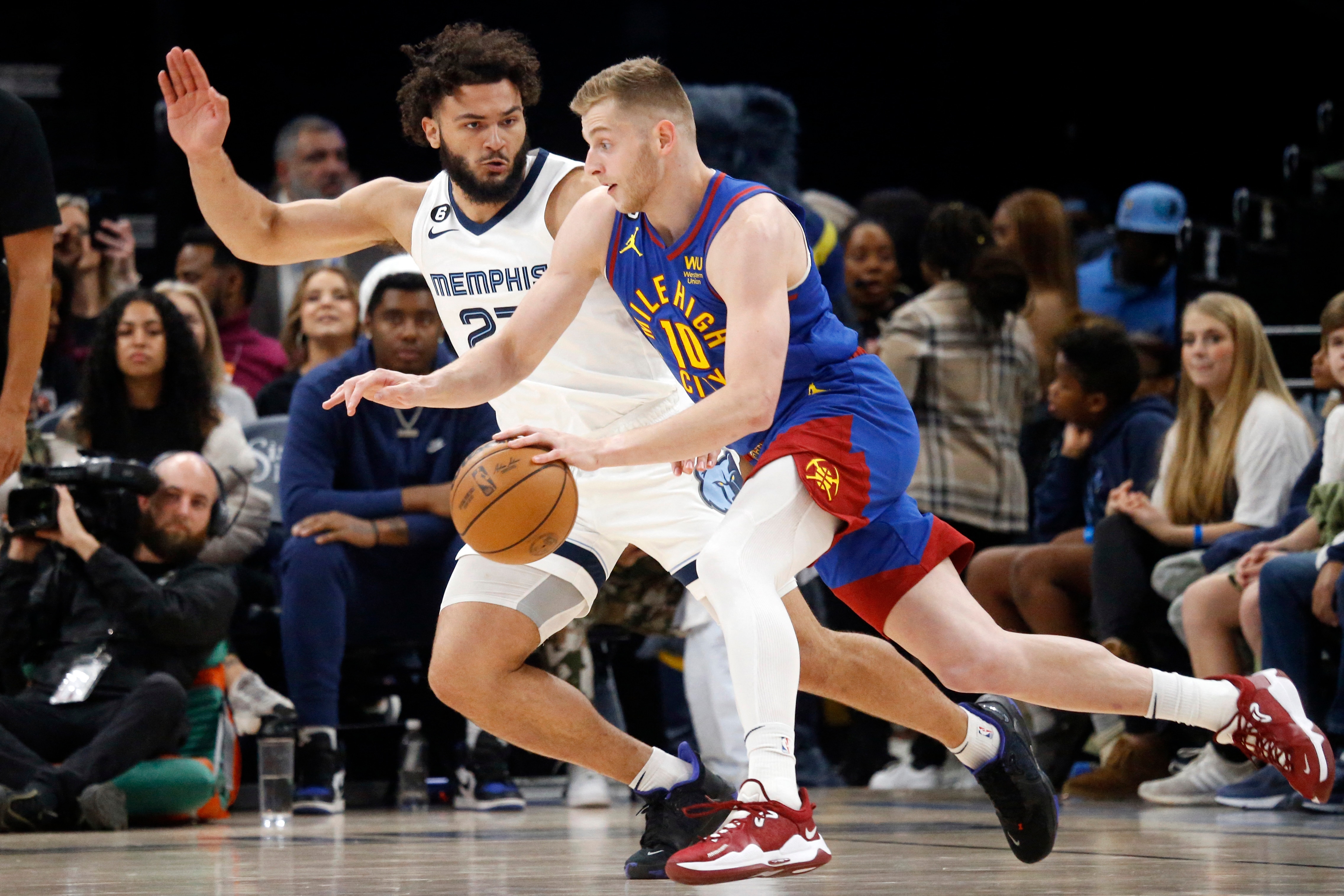 Denver Nuggets forward Jack White (10) dribbles as Memphis Grizzlies forward David Roddy (27) defends during the second half at FedExForum. (USA TODAY Sports)