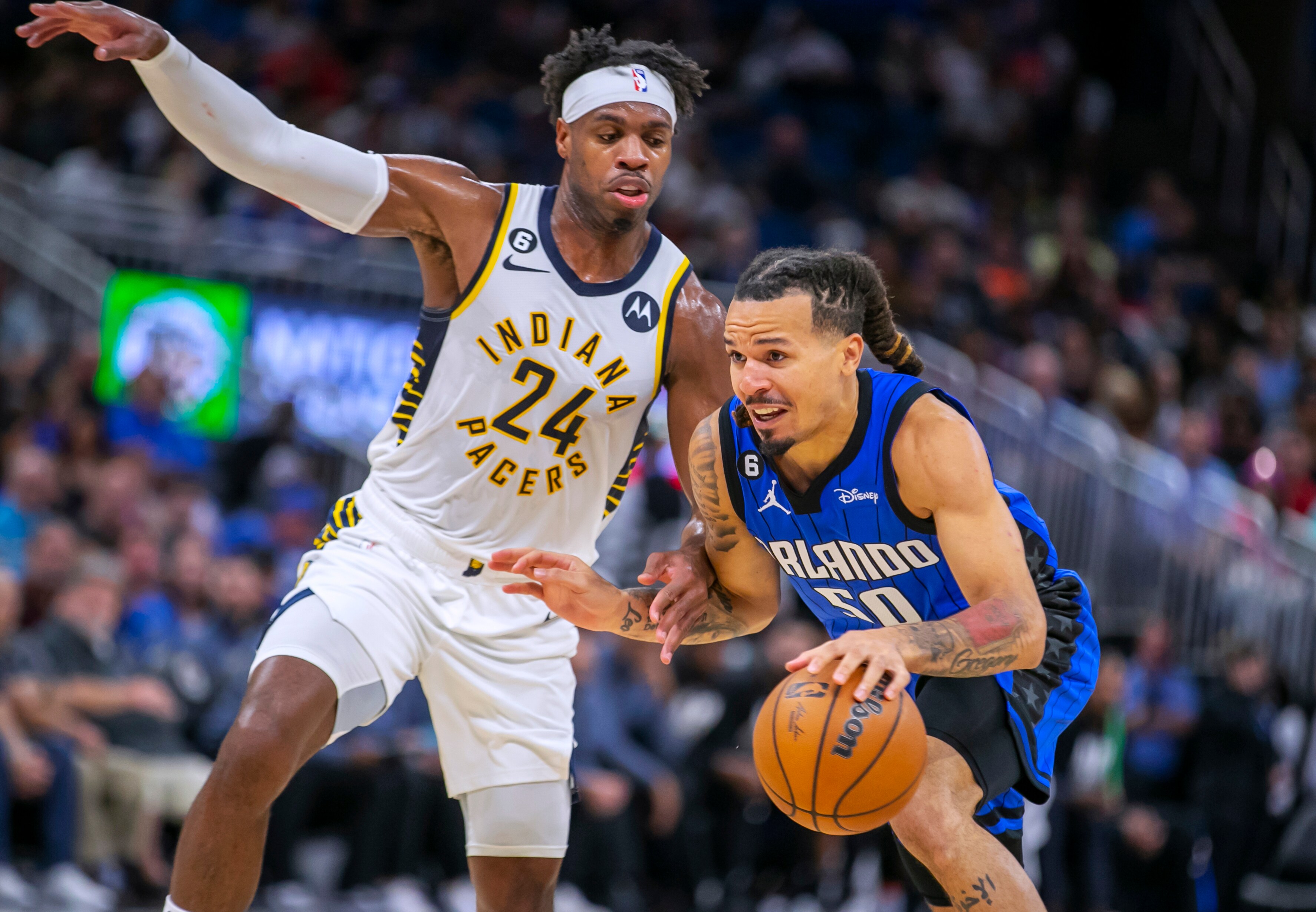 Indiana Pacers guard Buddy Hield (24) defends against Orlando Magic guard Cole Anthony (50) during the second half of an NBA basketball game Saturday, Feb. 25, 2023, in Orlando. (AP)