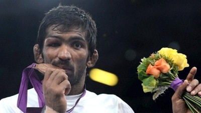 Yogeshwar Dutt poses with bronze medal during the medal ceremony of Men's 60kg Freestyle at the Olympic Games in London (PTI)