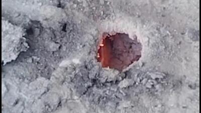 A flame can be seen in a hole on the road. Residents of the area received a message from IGL stating that gas supply will remain disrupted till 1 pm. (HT Photo) A flame can be seen in a hole on the road. Residents of the area received a message from IGL stating that gas supply will remain disrupted till 1 pm. (HT Photo)