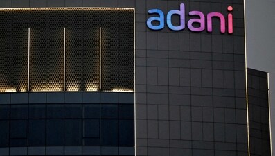 The logo of the Adani group is seen on the facade of one of its buildings on the outskirts of Ahmedabad. (Reuters)