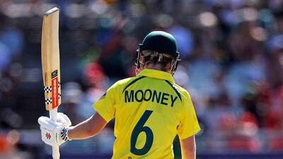 Australia's Beth Mooney raises her bat after completing fifty during the final match of ICC Women's T20 World Cup 2023 against South Africa, at Newlands, in Cape Town (Australia Women Cricket Twitter/ANI)