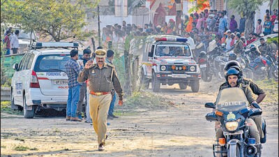Locals and police personnel at the encounter spot where Arbaaz, a suspect in Umesh Pal's killing, was killed, in Prayagraj on Monday. (PTI) Locals and police personnel at the encounter spot where Arbaaz, a suspect in Umesh Pal's killing, was killed, in Prayagraj on Monday. (PTI)