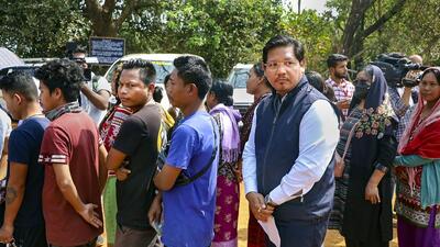 Meghalaya chief minister Conrad Sangma in a queue outside a polling booth. (PTI) Meghalaya chief minister Conrad Sangma in a queue outside a polling booth. (PTI)
