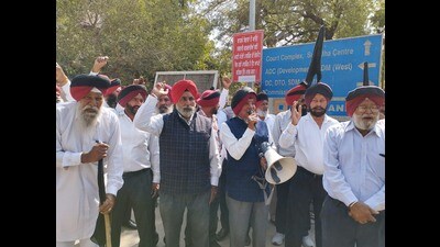 Members of Guardians of Governance (GoG) holding protest at DC office in Ludhiana on Monday. (HT Photo)