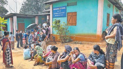 People stand in a queue outside a polling booth in Meghalaya’s Ri Bhoi district on Monday. (PTI) People stand in a queue outside a polling booth in Meghalaya’s Ri Bhoi district on Monday. (PTI)