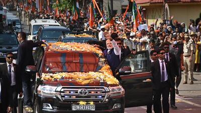 Prime Minister Narendra Modi waves at supporters during a roadshow, in Belagavi. (PTI) Prime Minister Narendra Modi waves at supporters during a roadshow, in Belagavi. (PTI)