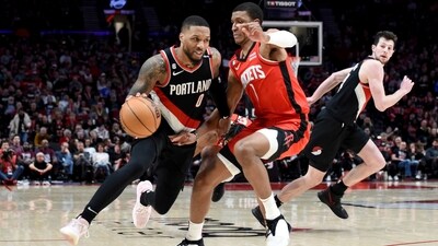 Portland Trail Blazers guard Damian Lillard, left, drives to the basket on Houston Rockets forward Jabari Smith Jr., right, during the second half of an NBA basketball game in Portland. (AP) Portland Trail Blazers guard Damian Lillard, left, drives to the basket on Houston Rockets forward Jabari Smith Jr., right, during the second half of an NBA basketball game in Portland. (AP)