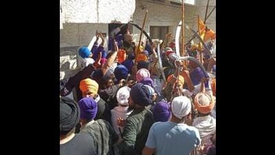 Six cops, including former Indian Hockey captain and SP-rank officer Jugraj Singh, were badly injured when the police tried to stop Amritpal’s supporters from entering the police station. (HT FILE PHOTO) Six cops, including former Indian Hockey captain and SP-rank officer Jugraj Singh, were badly injured when the police tried to stop Amritpal’s supporters from entering the police station. (HT FILE PHOTO)