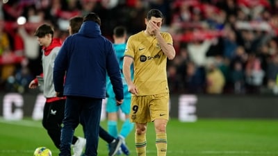 Barcelona's Robert Lewandowski leaves the pitch at the end of their 1-0 loss to Almeria in La Liga. (AP) Barcelona's Robert Lewandowski leaves the pitch at the end of their 1-0 loss to Almeria in La Liga. (AP)