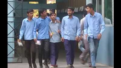 Students coming out of a centre after appearing in their UP Board exams in Prayagraj on Monday. (HT Photo)