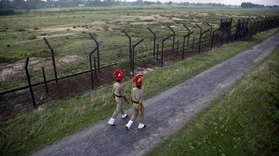 Border Security Force personnel patrol near a fence on the India- Bangladesh border. (AP File / Representational Image) Border Security Force personnel patrol near a fence on the India- Bangladesh border. (AP File / Representational Image)