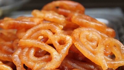 10. Jalebi: This is a popular sweet from North India. It is made with a deep-fried batter, soaked in a sugar syrup. It is a delicious snack that can be found on the streets of Delhi and other cities in the state. (Pixabay) 10. Jalebi: This is a popular sweet from North India. It is made with a deep-fried batter, soaked in a sugar syrup. It is a delicious snack that can be found on the streets of Delhi and other cities in the state. (Pixabay)