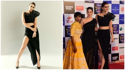Kriti Sanon attended the event in a black top and uneven skirt paired with matching heels. She joined Sunny Leone on the red carpet to pose for pics. (Varinder Chawla) 