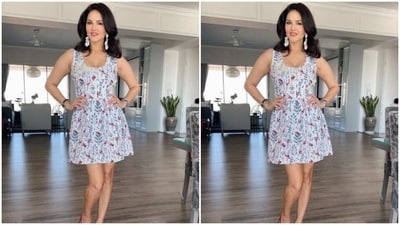 Sunny looked stunning in the white summer dress featuring floral patterns in shades of red, blue and black. The dress also came with sleeveless details and a plunging neckline. (Instagram/@sunnyleone) Sunny looked stunning in the white summer dress featuring floral patterns in shades of red, blue and black. The dress also came with sleeveless details and a plunging neckline. (Instagram/@sunnyleone)