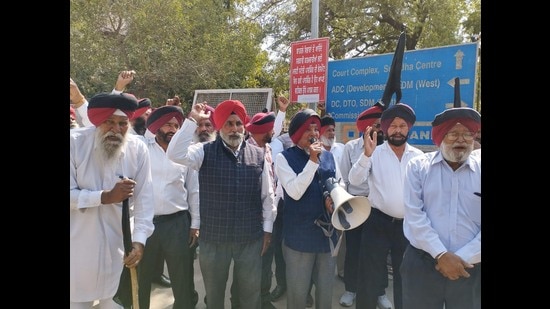 Members of Guardians of Governance (GoG) holding protest at DC office in Ludhiana on Monday. (HT Photo)