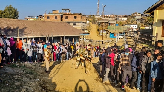 Voters wait in queues to cast their votes at a polling booth during the Nagaland Assembly elections, in Shamator district of Nagaland.(PTI)