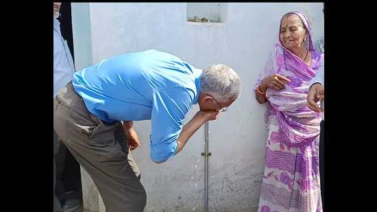Parameswaran Iyer, executive director-designate, World Bank, drinking water from a tap in a Bundelkhand village on Feb 27. (Sourced)