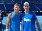 James McCabe with Novak Djokovic James McCabe with Novak Djokovic