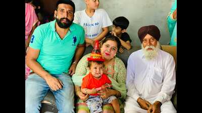 Gurpreet Singh (blue T-shirt), 30, a former cop who died of drug overdose, with his family at Saleena village in Moga district. (HT File photo)