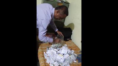 Pune Zilla Parishad flying squad head Kisan Bhujbal seized exam copy material including photo copies of pages, textbooks, chits, guides from the exam centre. (HT PHOTO) Pune Zilla Parishad flying squad head Kisan Bhujbal seized exam copy material including photo copies of pages, textbooks, chits, guides from the exam centre. (HT PHOTO)