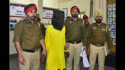 The double murder accused in police custody in Ludhiana on Tuesday. (Gurpreet Singh/HT Photo) The double murder accused in police custody in Ludhiana on Tuesday. (Gurpreet Singh/HT Photo)