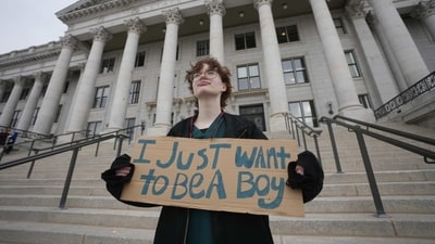 Tree Crane, 17, poses for a photograph following a rally where hundreds gathered in support of transgender youth at the Utah State Capitol Tuesday, Jan. 24, 2023, in Salt Lake City. Utah lawmakers on Friday, Jan. 27, 2023, gave final approval for a measure that would ban most transgender youth from receiving gender-affirming health care like surgery or puberty blockers. (AP Photo/Rick Bowmer) (AP) Tree Crane, 17, poses for a photograph following a rally where hundreds gathered in support of transgender youth at the Utah State Capitol Tuesday, Jan. 24, 2023, in Salt Lake City. Utah lawmakers on Friday, Jan. 27, 2023, gave final approval for a measure that would ban most transgender youth from receiving gender-affirming health care like surgery or puberty blockers. (AP Photo/Rick Bowmer) (AP)
