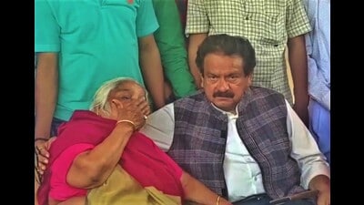 Union minister of state for law and justice, SP Singh Baghel, with mother of slain lawyer, Umesh Pal, at their house in Sulem Sarai area of Prayagraj on Tuesday. (HT Photo)
