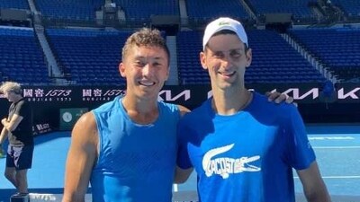 James McCabe with Novak Djokovic James McCabe with Novak Djokovic