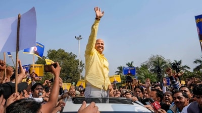 Delhi deputy chief minister Manish Sisodia waves at supporters on Sunday. (PTI) Delhi deputy chief minister Manish Sisodia waves at supporters on Sunday. (PTI)