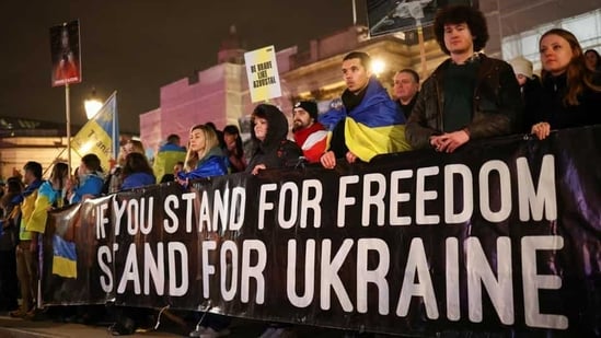 People attend a vigil for Ukraine held on the anniversary of the conflict with Russia, at Trafalgar Square in London, Britain. (Reuters)