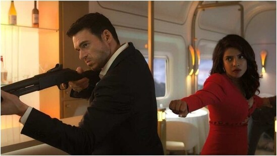 Priyanka Chopra wears a red cut-out dress in this first look of Citadel with Richard Madden. (Instagram)