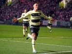 Manchester City's Phil Foden celebrates after scoring his side's opening goal during an English FA Cup fifth-round soccer match between Bristol City and Manchester City at Ashton Gate stadium in Bristol, England, Tuesday, Feb. 28, 2023. (Adam Davy/PA via AP)