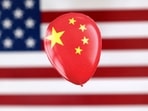 China Spy Balloon: A printed balloon with Chinese flag is placed on a US flag in this illustration.(Reuters)