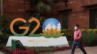 A man walks past a model of G20 logo outside the finance ministry in New Delhi on March 1 (REUTERS) A man walks past a model of G20 logo outside the finance ministry in New Delhi on March 1 (REUTERS)