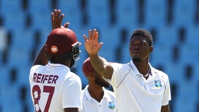 Cricket - First Test - South Africa v West Indies - SuperSport Park Cricket Stadium, Centurion, South Africa - March 1, 2023 West Indies' Alzarri Joseph celebrates with Raymon Reifer after taking the wicket of South Africa's Gerald Coetzee REUTERS/Siphiwe Sibeko (REUTERS)