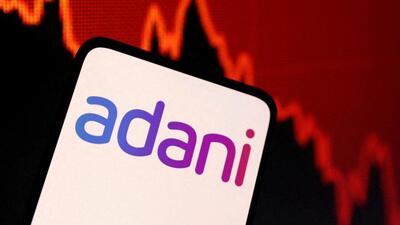 FILE PHOTO: Adani logo and decreasing stock graph is seen in this illustration taken on January 31 (REUTERS) FILE PHOTO: Adani logo and decreasing stock graph is seen in this illustration taken on January 31 (REUTERS)