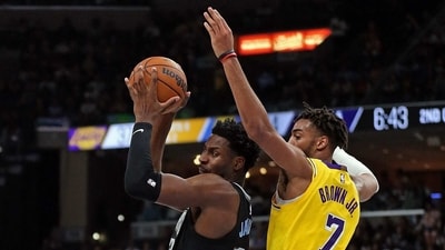 Jaren Jackson Jr. #13 of the Memphis Grizzlies goes to the basket against Troy Brown Jr. #7 of the Los Angeles Lakers during the first half at FedExForum. (Getty Images via AFP)